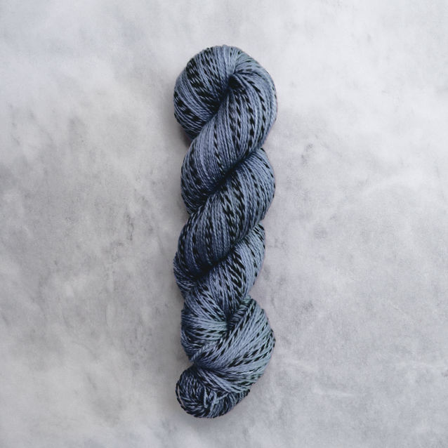 Jeans blue skein of yarn with black stripes.