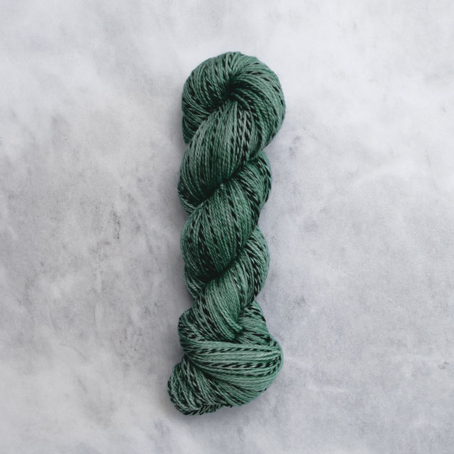 Medium green skein of yarn with black stripes.