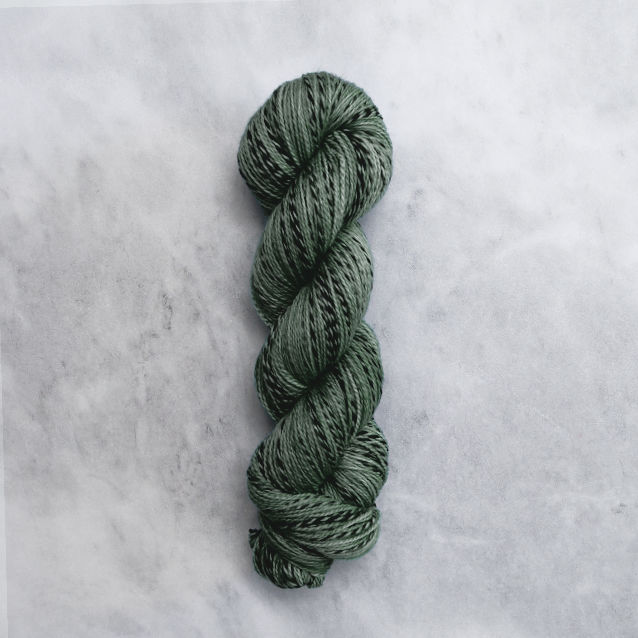 Grey-green skein of yarn with black stripes.