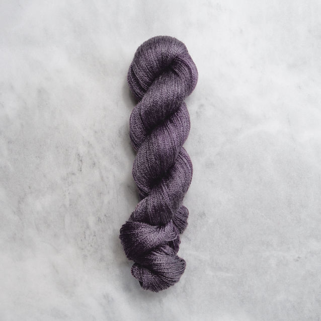 Dark purple skein of yarn with silver shimmer.