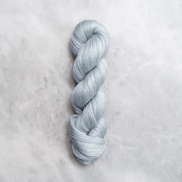 Forget-me-not blue skein of yarn with silver shimmer.