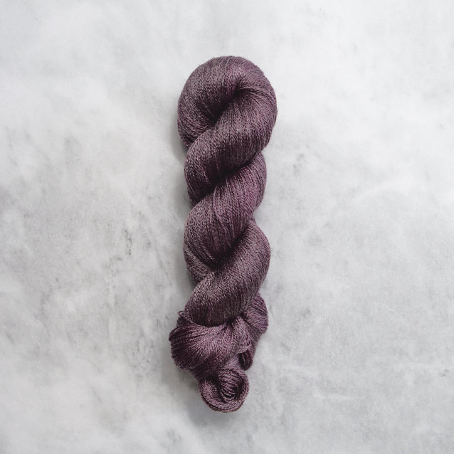 Dark violet skein of yarn with silver shimmer.