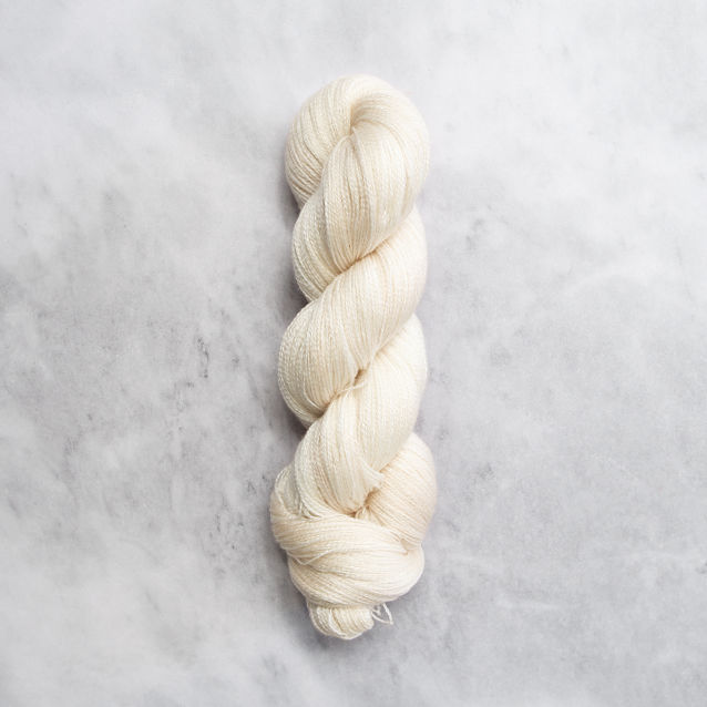 Pale yellow skein of yarn with silver shimmer.