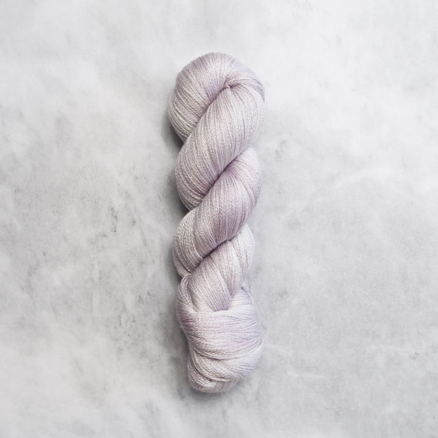 Light purple skein of yarn with silver shimmer.