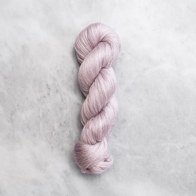 Light blueish pink skein of yarn with silver shimmer.