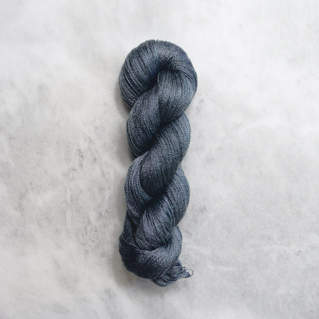 Dark navy skein of yarn with silver shimmer.