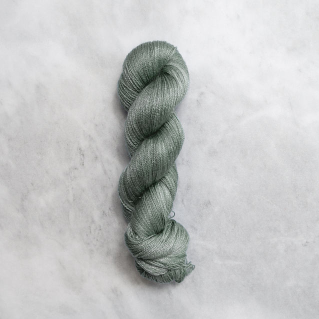 Medium grey-green skein of yarn with silver shimmer.