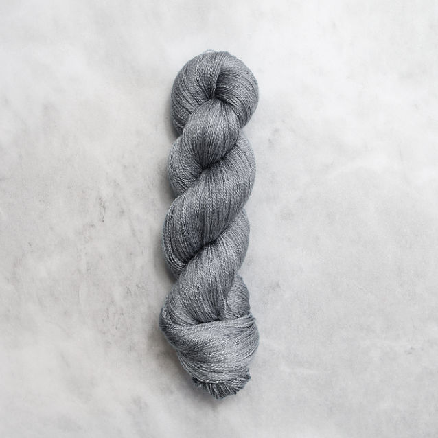 Medium grey skein of yarn with silver shimmer.