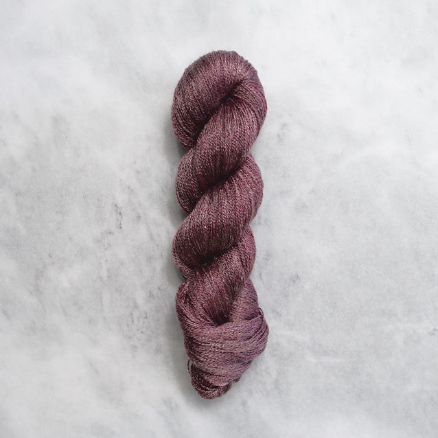 Dark red skein of yarn with silver shimmer.