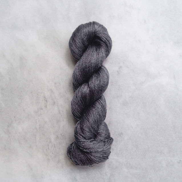 Dark grey skein of yarn with silver shimmer.